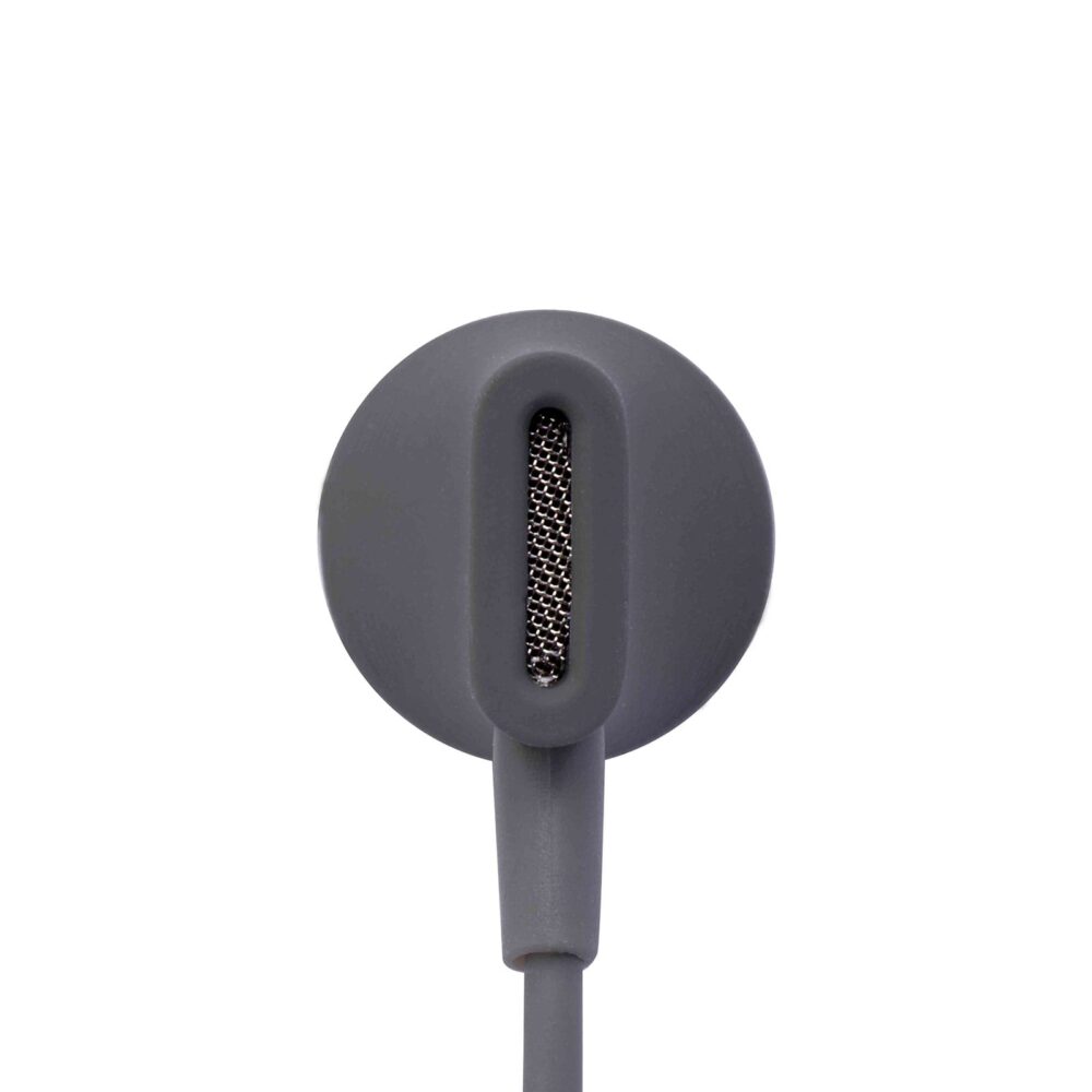 A close-up view of a charcoal-colored in-ear headphone showing the back side with a mesh-covered speaker grille.